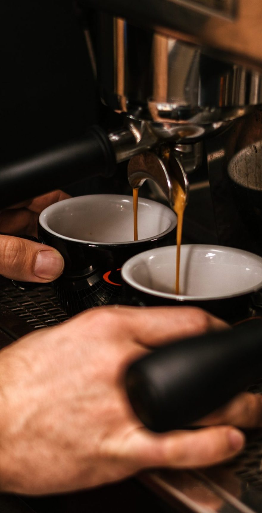 Barista hands while making a cup of coffee Barista hands while making a cup of coffee